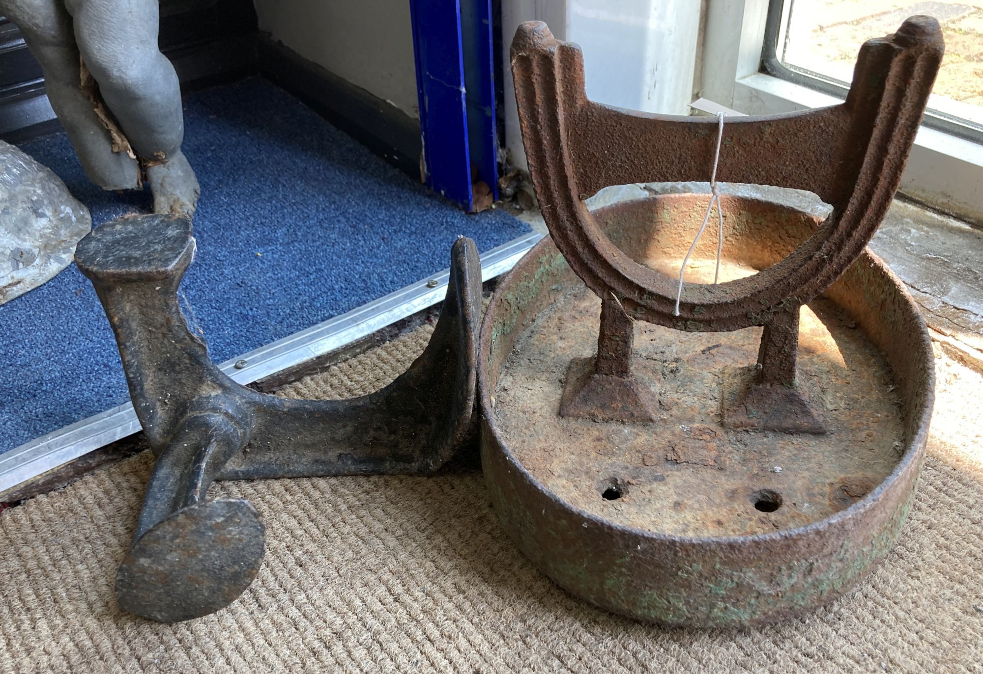 A Victorian cast iron boot scraper, width 33cm, height 26cm together with a cast iron Cobbler's last